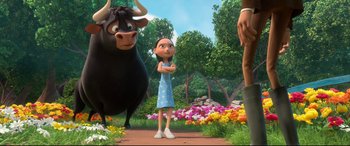 Movie still from “Ferdinand” (2017), directed by Carlos Saldanha – A woman standing next to a bull in a field of flowers; Wide shot, Low angle
