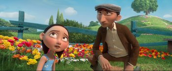 Movie still from “Ferdinand” (2017), directed by Carlos Saldanha – A man and a woman sitting in a field of flowers; Medium shot, Low angle