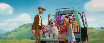 Movie still from “Ferdinand” (2017), directed by Carlos Saldanha – A scene from a cartoon with a dog sitting on the back of a truck; Wide shot, Low angle