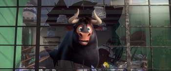 Movie still from “Ferdinand” (2017), directed by Carlos Saldanha – A black bull with horns is hanging from the ceiling; Medium shot, Low angle