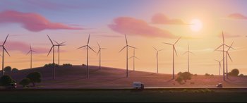 Movie still from “Ferdinand” (2017), directed by Carlos Saldanha – A van driving down a road near a field of wind turbines; Extreme Wide shot, Low angle