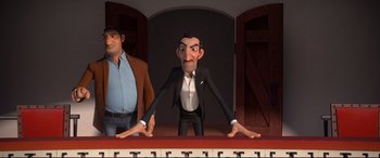 Movie still from “Ferdinand” (2017), directed by Carlos Saldanha – A man in a suit standing next to another man in a black suit; Medium shot, Over the shoulder angle