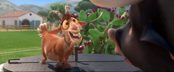 Movie still from “Ferdinand” (2017), directed by Carlos Saldanha – A goat standing next to a man in a cactus field; Medium shot, Low angle