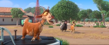 Movie still from “Ferdinand” (2017), directed by Carlos Saldanha – A goat standing next to a dog in a field with other animals; Medium shot, Low angle
