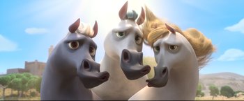 Movie still from “Ferdinand” (2017), directed by Carlos Saldanha – A group of three horses that are standing in the grass; Close Up shot, High angle