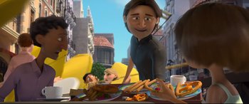 Movie still from “Ferdinand” (2017), directed by Carlos Saldanha – An animated person standing in front of a plate of food; Medium shot, Over the shoulder angle