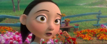 Movie still from “Ferdinand” (2017), directed by Carlos Saldanha – An animated girl is looking up at the camera; Close Up shot, Over the shoulder angle