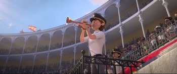 Movie still from “Ferdinand” (2017), directed by Carlos Saldanha – An animated person playing a trumpet in front of an audience; Medium shot, Low angle