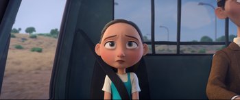 Movie still from “Ferdinand” (2017), directed by Carlos Saldanha – A girl sitting in the back of a car with a seatbelt on; Close Up shot, Over the shoulder angle