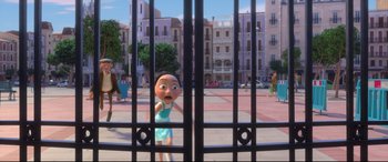 Movie still from “Ferdinand” (2017), directed by Carlos Saldanha – An animated figure is standing behind a gate; Wide shot, Over the shoulder angle