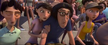 Movie still from “Ferdinand” (2017), directed by Carlos Saldanha – A man and a woman are standing in front of a group of people; Medium shot, Over the shoulder angle