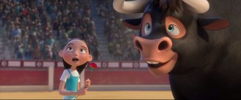 Movie still from “Ferdinand” (2017), directed by Carlos Saldanha – A girl and a bull are standing next to each other; Medium shot, Low angle