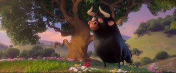 Movie still from “Ferdinand” (2017), directed by Carlos Saldanha – An animated bull standing next to a tree; Wide shot, Low angle