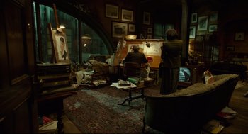 Movie still from “The Shape of Water” (2017), directed by Guillermo del Toro – A couple of people are sitting in a living room; Wide shot, High angle