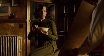 Movie still from “The Shape of Water” (2017), directed by Guillermo del Toro – A woman is eating a bowl of soup; Medium shot, Over the shoulder angle