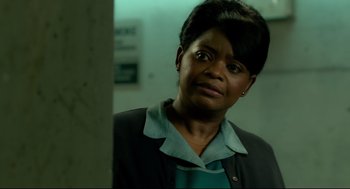 Movie still from “The Shape of Water” (2017), directed by Guillermo del Toro – An older woman is looking at the camera; Close Up shot, Over the shoulder angle