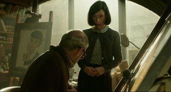 Movie still from “The Shape of Water” (2017), directed by Guillermo del Toro – An older man and a young woman standing in front of a window; Medium shot, Over the shoulder angle