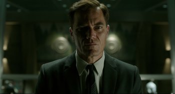 Movie still from “The Shape of Water” (2017), directed by Guillermo del Toro – A man in a suit and tie; Close Up shot, Low angle