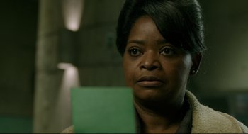 Movie still from “The Shape of Water” (2017), directed by Guillermo del Toro – A person holding a piece of paper; Close Up shot, Over the shoulder angle