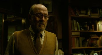 Movie still from “The Shape of Water” (2017), directed by Guillermo del Toro – An older man wearing glasses and a tie; Close Up shot, Low angle