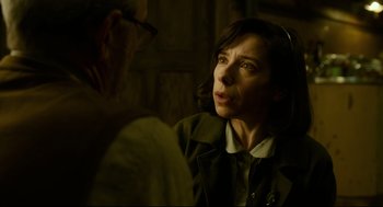 Movie still from “The Shape of Water” (2017), directed by Guillermo del Toro – A woman is looking at a man in a dark room; Close Up shot, Over the shoulder angle