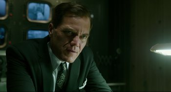 Movie still from “The Shape of Water” (2017), directed by Guillermo del Toro – A person wearing a suit and tie; Close Up shot, Low angle