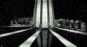 Movie still from “The Shape of Water” (2017), directed by Guillermo del Toro – A black - and - white photo of a building with a sky background; Extreme Wide shot, High angle