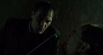 Movie still from “The Shape of Water” (2017), directed by Guillermo del Toro – A man with a knife in his mouth next to a woman; Close Up shot, Low angle