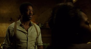 Movie still from “The Shape of Water” (2017), directed by Guillermo del Toro – A man standing in front of another man; Medium shot, Over the shoulder angle