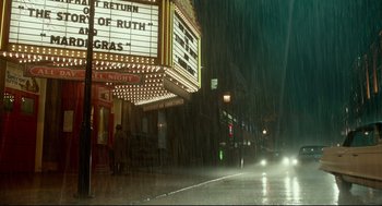 Movie still from “The Shape of Water” (2017), directed by Guillermo del Toro – A rainy night in front of a movie theater; Extreme Wide shot, Low angle