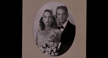 Movie still from “Field of Dreams” (1989), directed by Phil Alden Robinson – An old black and white photo of a man and a woman; Extreme Close Up shot, High angle