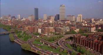 Movie still from “Field of Dreams” (1989), directed by Phil Alden Robinson – An aerial view of a large city with a lot of buildings; Extreme Wide shot, High angle