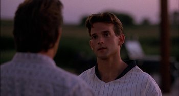 Movie still from “Field of Dreams” (1989), directed by Phil Alden Robinson – A baseball player talking to another baseball player; Close Up shot, Over the shoulder angle