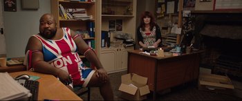 Movie still from “Fighting with My Family” (2019), directed by Stephen Merchant – Two women sitting at a table in a room; Medium shot, Over the shoulder angle