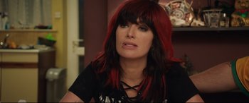 Movie still from “Fighting with My Family” (2019), directed by Stephen Merchant – A person with long hair; Close Up shot, Over the shoulder angle