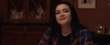 Movie still from “Fighting with My Family” (2019), directed by Stephen Merchant – A woman in a plaid shirt is smiling for the camera; Close Up shot, Over the shoulder angle