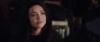 Movie still from “Fighting with My Family” (2019), directed by Stephen Merchant – A person with long black hair; Close Up shot, Over the shoulder angle