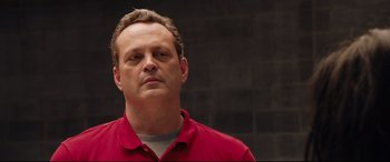 Movie still from “Fighting with My Family” (2019), directed by Stephen Merchant – A person wearing a red shirt; Close Up shot, Over the shoulder angle