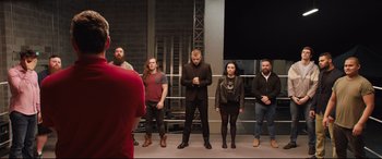 Movie still from “Fighting with My Family” (2019), directed by Stephen Merchant – A group of people standing on a stage in front of an audience; Wide shot, Over the shoulder angle