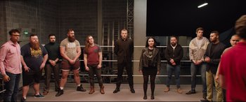 Movie still from “Fighting with My Family” (2019), directed by Stephen Merchant – A group of men and women standing next to each other; Wide shot, Low angle