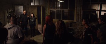 Movie still from “Fighting with My Family” (2019), directed by Stephen Merchant – A group of people standing in front of a building; Wide shot, Over the shoulder angle