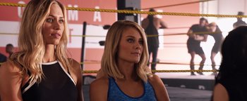 Movie still from “Fighting with My Family” (2019), directed by Stephen Merchant – A beautiful blonde woman in a boxing ring; Close Up shot, Over the shoulder angle