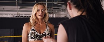 Movie still from “Fighting with My Family” (2019), directed by Stephen Merchant – A woman is talking to another woman in front of a mirror; Close Up shot, Over the shoulder angle