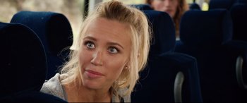 Movie still from “Fighting with My Family” (2019), directed by Stephen Merchant – A woman sitting on a bus looking at the camera; Close Up shot, Over the shoulder angle