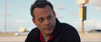 Movie still from “Fighting with My Family” (2019), directed by Stephen Merchant – A person wearing a black jacket; Close Up shot, Over the shoulder angle