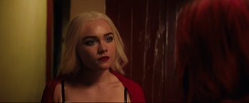Movie still from “Fighting with My Family” (2019), directed by Stephen Merchant – A woman with blonde hair and a red shirt; Close Up shot, Over the shoulder angle
