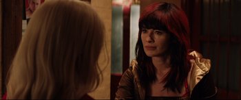 Movie still from “Fighting with My Family” (2019), directed by Stephen Merchant – A woman with red and black hair looking into a mirror; Close Up shot, Over the shoulder angle