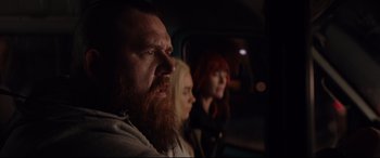 Movie still from “Fighting with My Family” (2019), directed by Stephen Merchant – A man and two women sitting in the back of a car; Close Up shot, Low angle