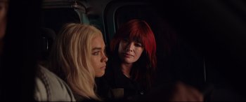 Movie still from “Fighting with My Family” (2019), directed by Stephen Merchant – Two women with long blonde and red hair on a bus; Close Up shot, Over the shoulder angle