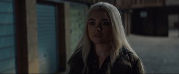 Movie still from “Fighting with My Family” (2019), directed by Stephen Merchant – A woman with long blonde hair wearing a leather jacket; Close Up shot, Over the shoulder angle